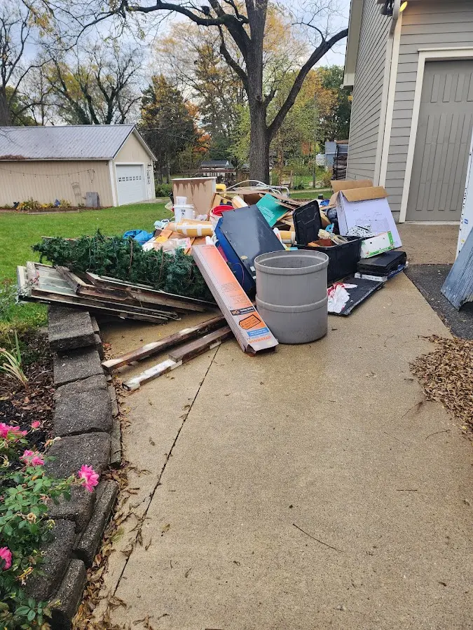 Dumpster being loaded with debris for Demolition Dumpster Rental in Cheshire